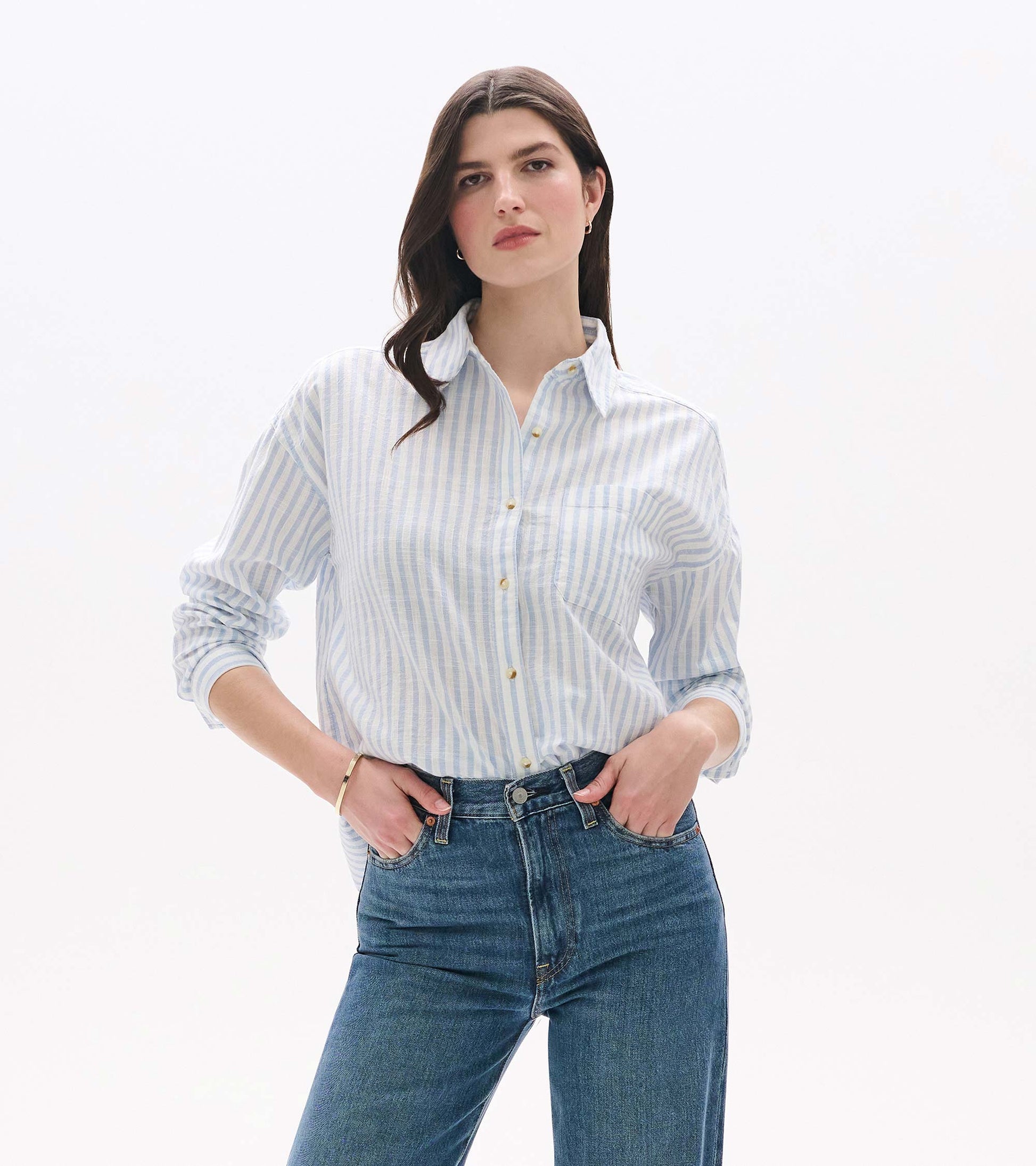 Front view of relaxed button-down shirt in pale blue and white stripes with chest pocket and collar