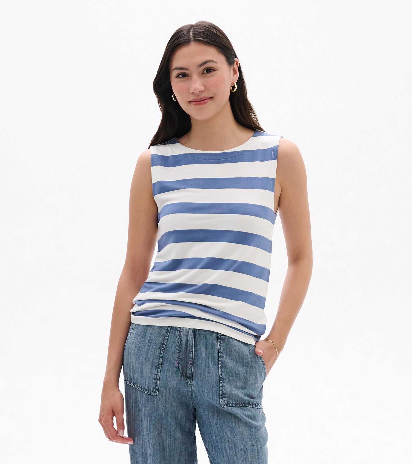Sleeveless white tank top with blue horizontal stripes, worn with jeans, front view