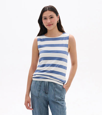 Sleeveless white tank top with blue horizontal stripes, worn with jeans, front view