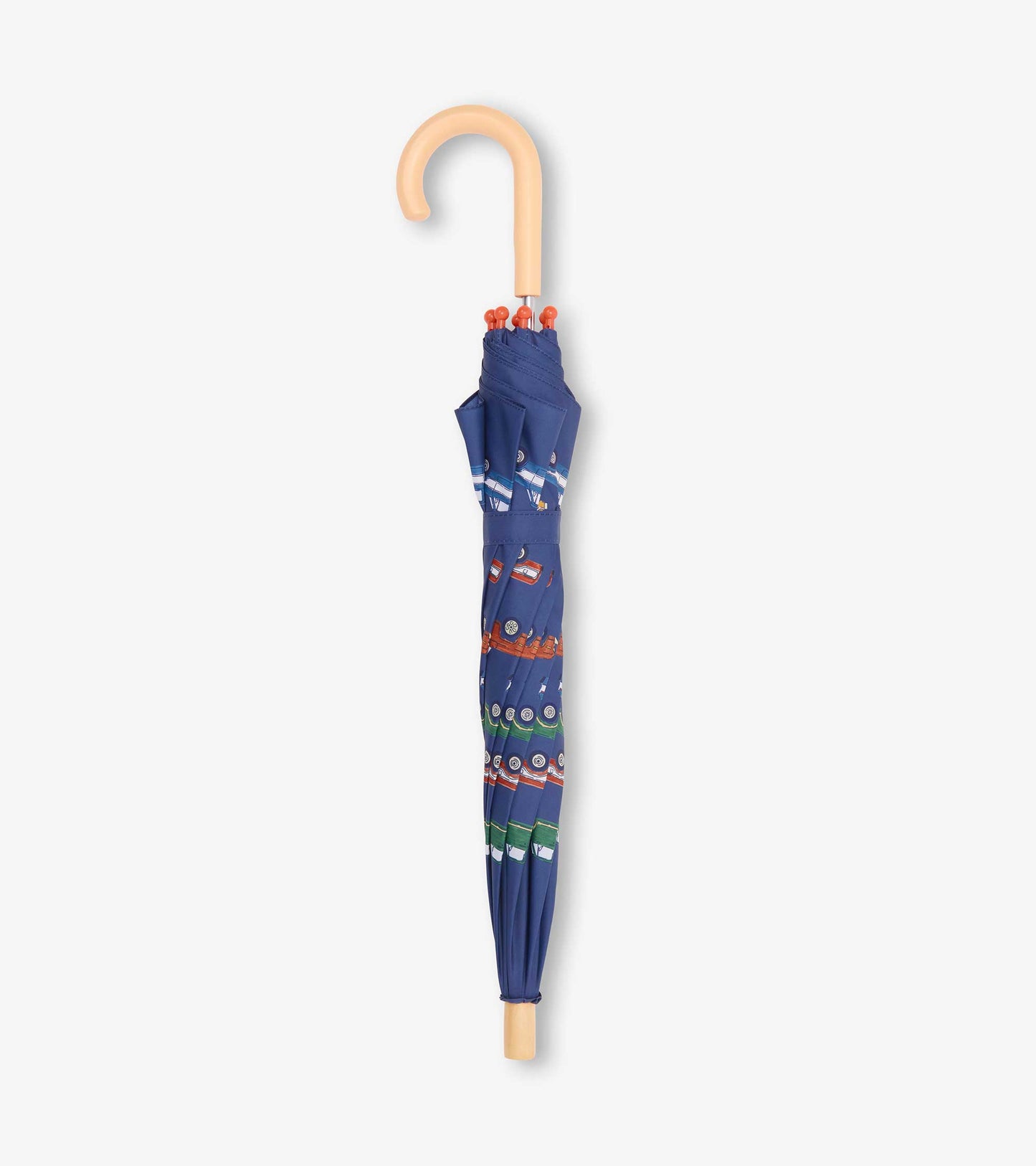 Folded navy kids umbrella with tan curved handle and colorful truck pattern