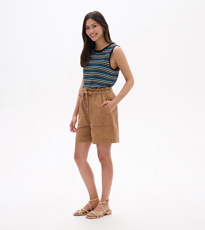 Tan high-waisted shorts with elastic waist, drawstring tie, and front pockets, worn on model.