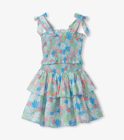 Girls floral smocked dress with tie shoulder straps and tiered ruffle skirt in blue, pink, and green