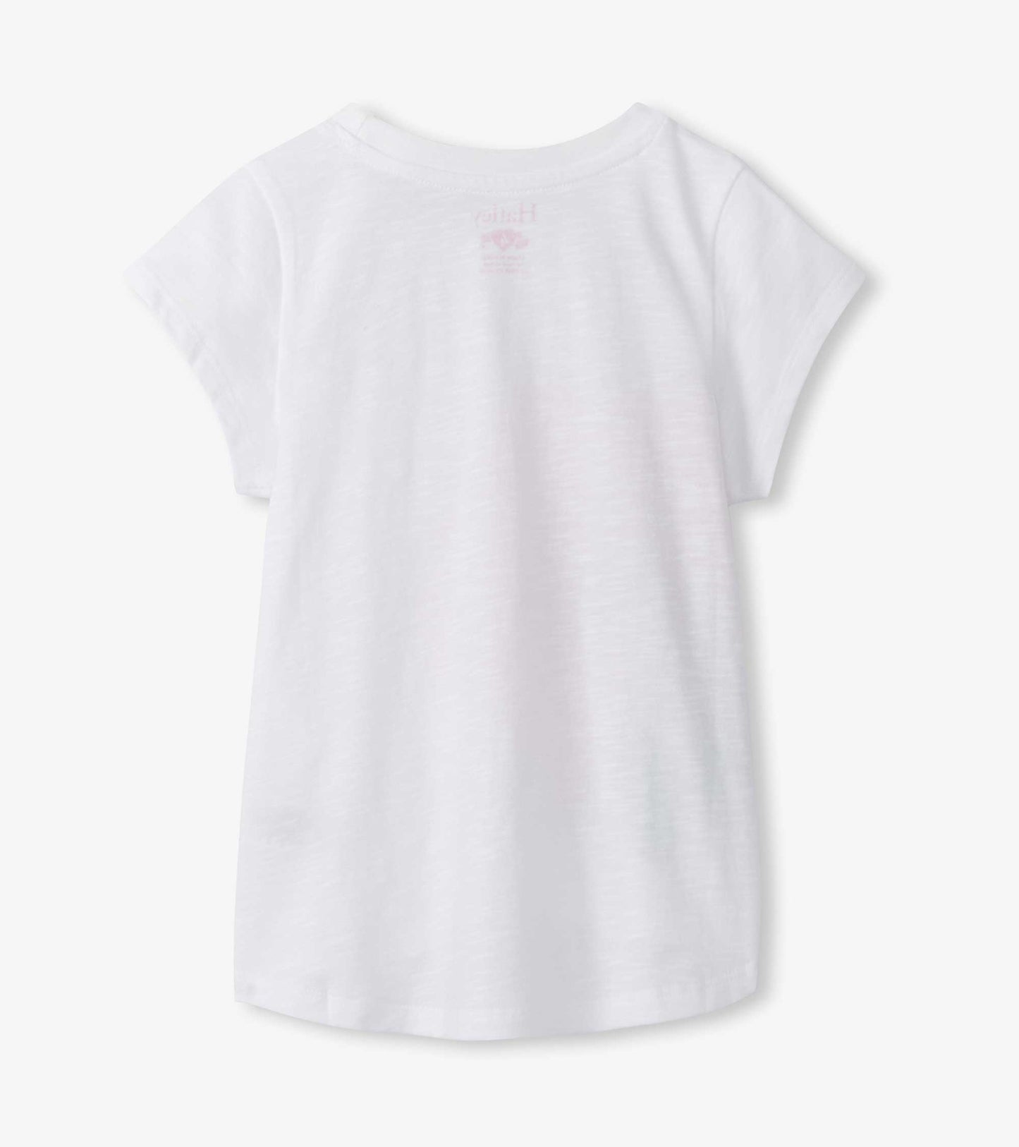 White girls short-sleeve T-shirt with crew neck and subtle pink hibiscus graphic on back, back view