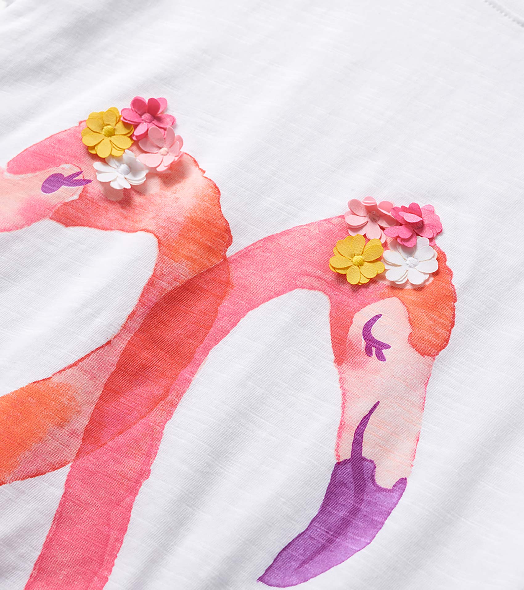 White girls' graphic tee with pink flamingo print and colorful flower appliqués