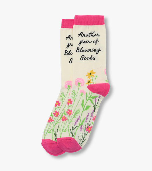 Pair of cream crew socks with pink cuffs and floral print, shown folded together.