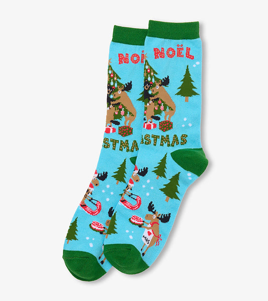 Light blue Christmas crew socks with green cuffs, moose and tree print, and 'Noel' text near the top