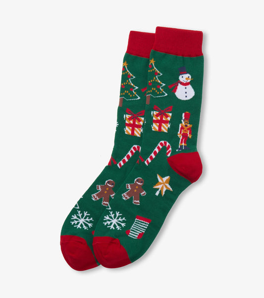 Green Christmas crew socks with red cuffs, heels and toes, featuring trees, snowman, gifts, candy canes and gingerbread men
