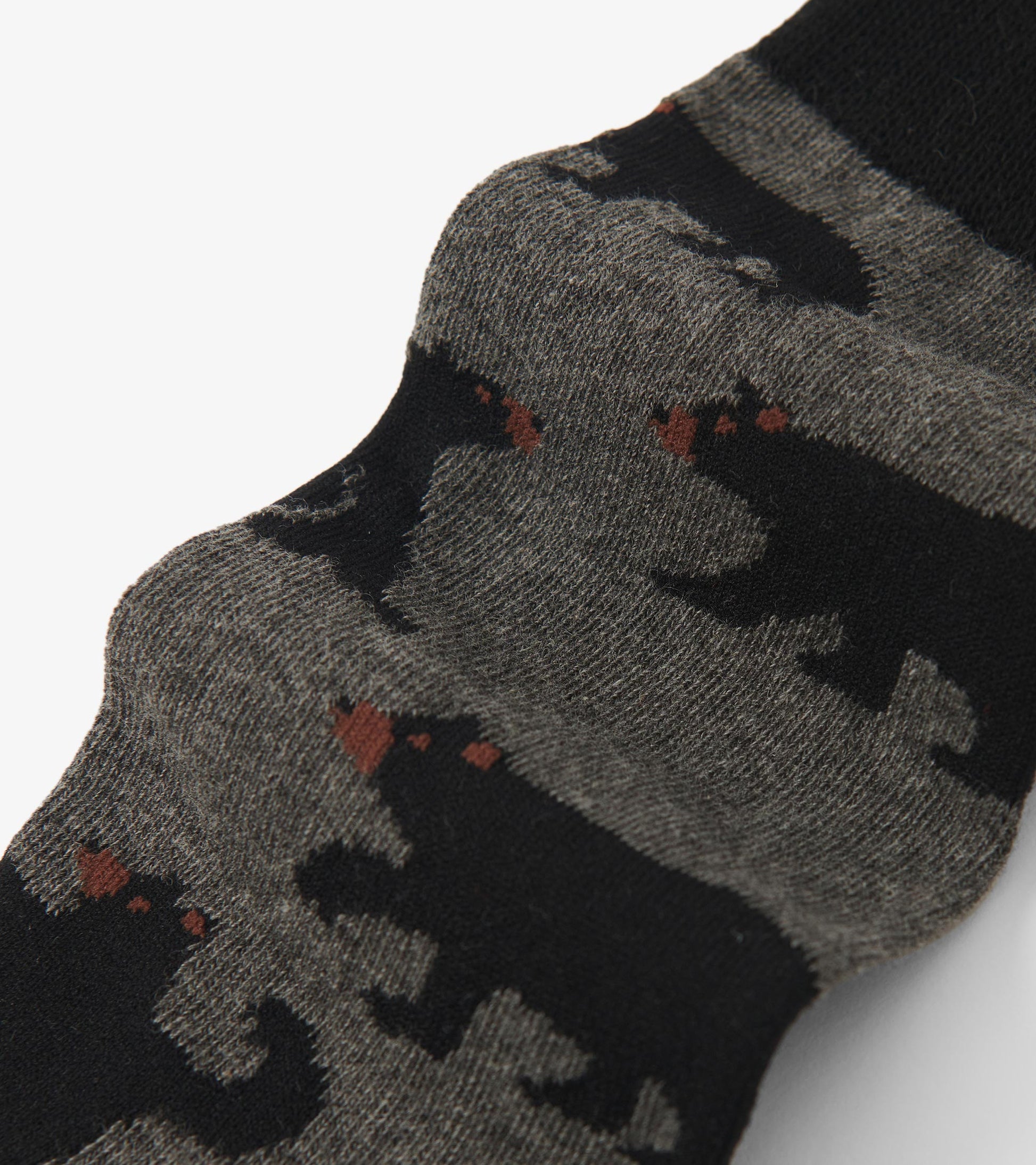 Gray crew socks featuring a bear pattern in black and brown, suitable for casual wear.