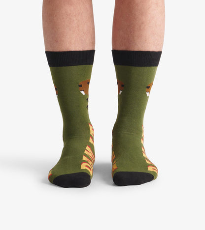 Green crew socks featuring a beaver design and "DAM IT" text, with black cuffs and toe. One size fits most.