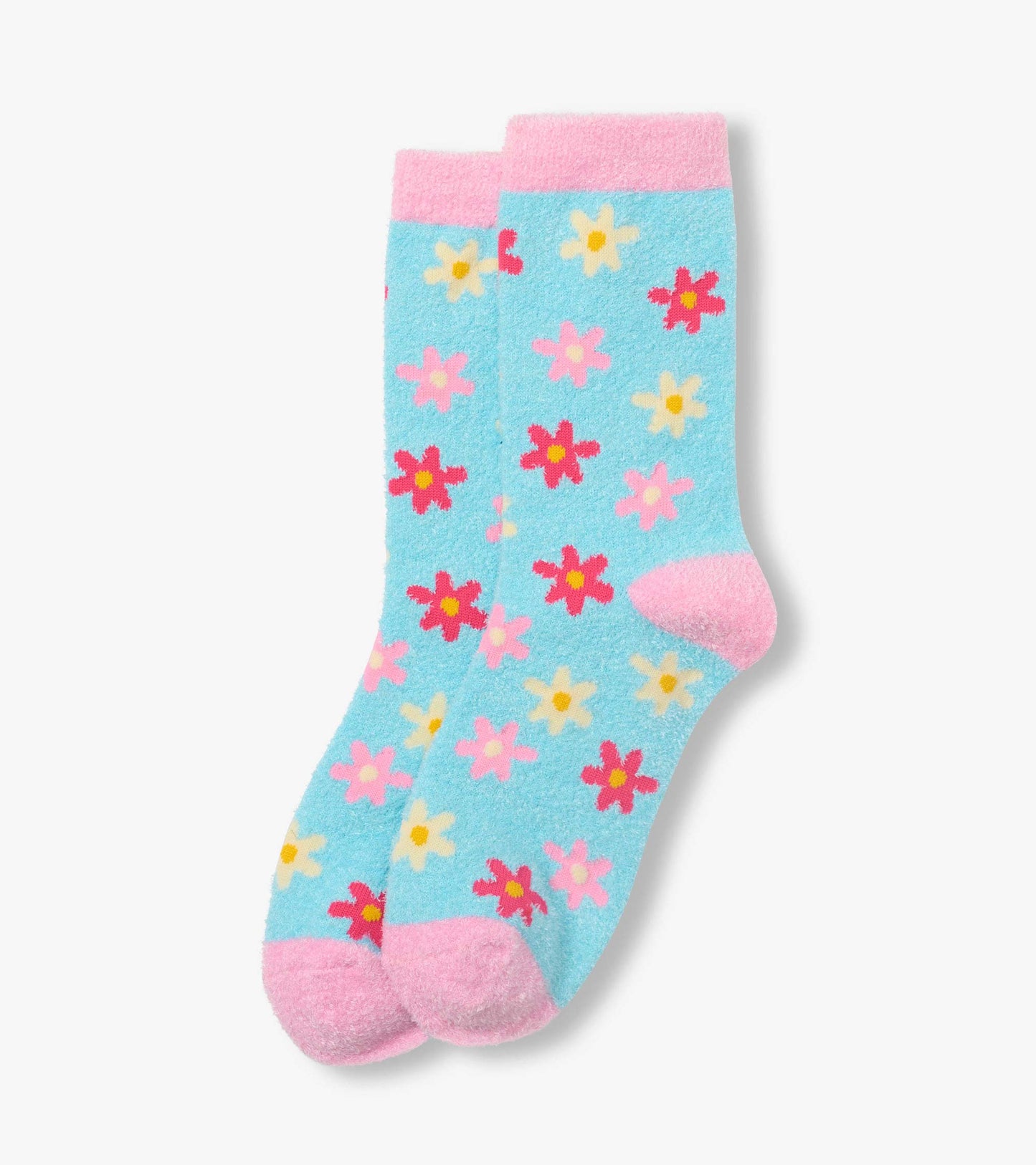 Pair of fuzzy crew socks with blue background, pink cuffs and toes, and multicolor floral pattern.