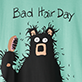 View Bad Hair Day Women's Sleepshirt - Black shaggy monster with a surprised face holding a pink comb, with text reading “Bad Hair Day”