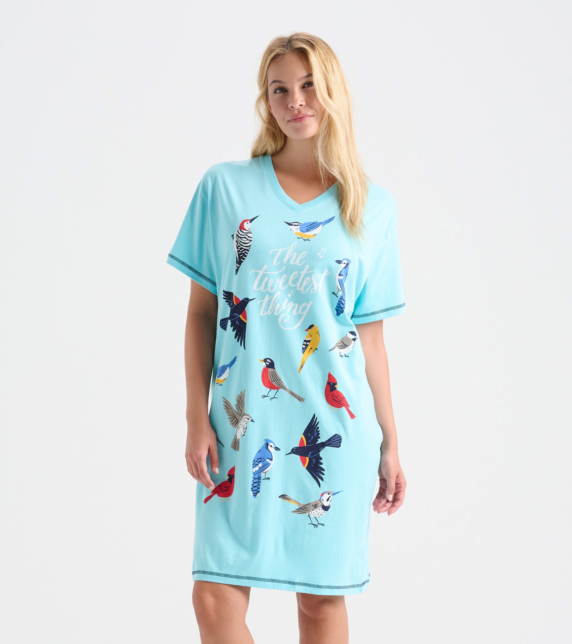 Model wearing aqua knee-length sleepshirt with V-neck, short sleeves, colorful bird print and 'The tweetest thing' text