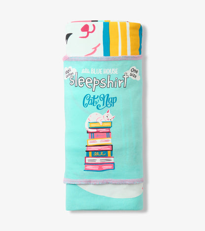 Rolled aqua sleepshirt with wrapper, showing Cat Nap text and white cat on stacked colorful books