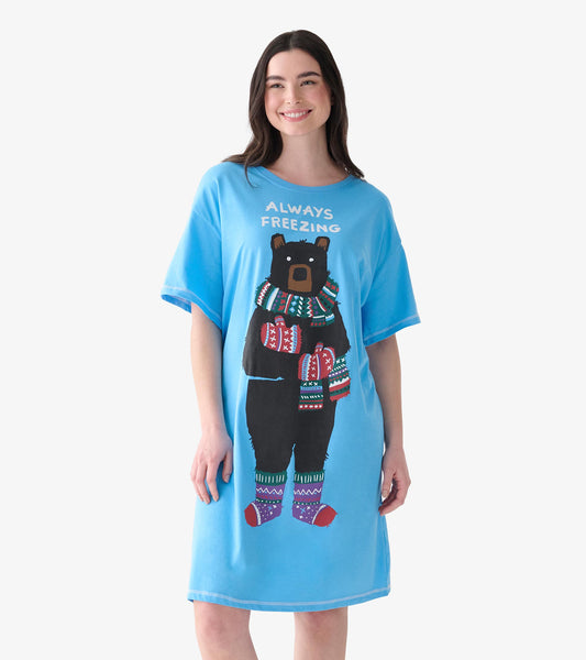 Model wearing a blue short-sleeve sleepshirt with Always Freezing text and a bear in winter accessories