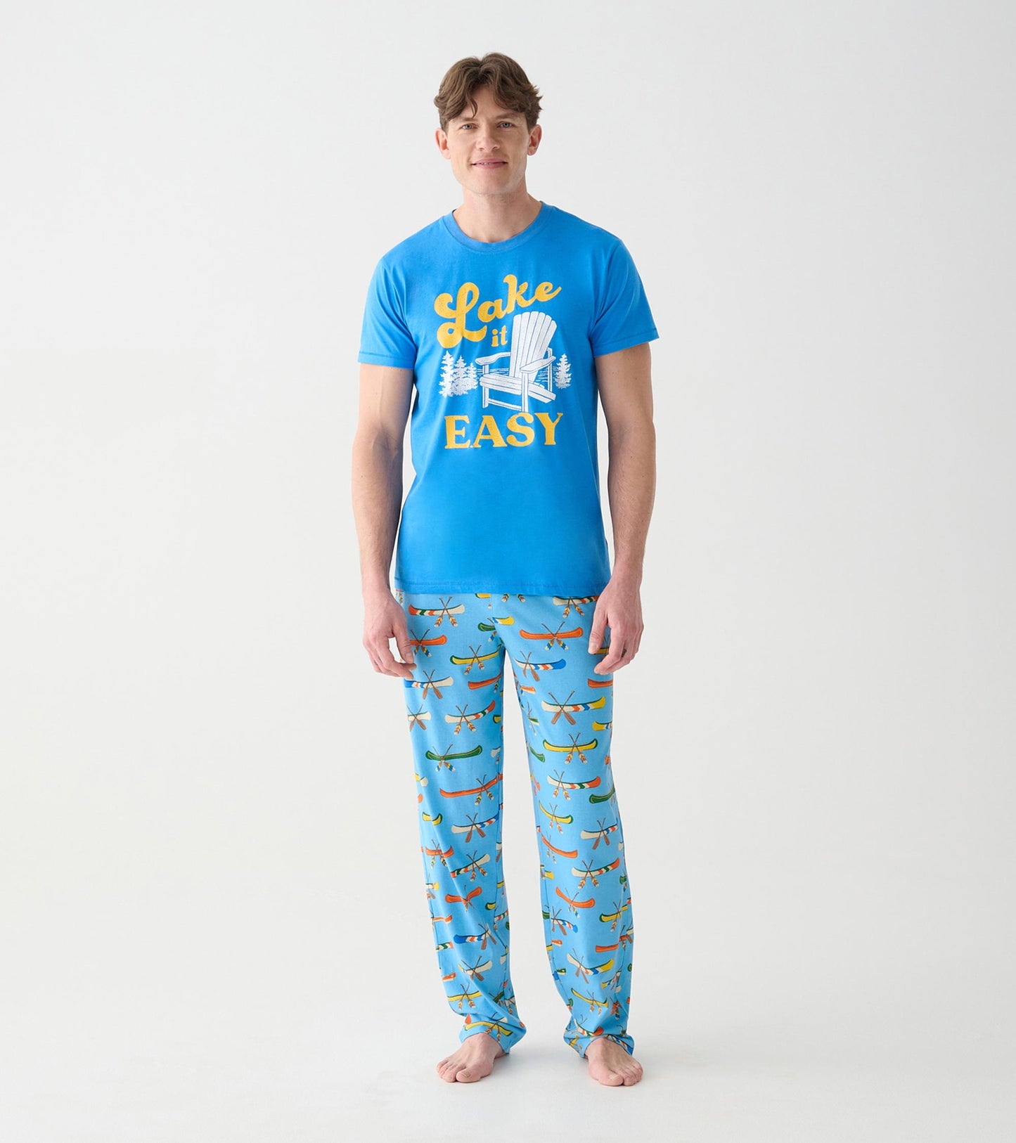 Full front view of blue Lake It Easy tee with yellow text and white chair graphic on model