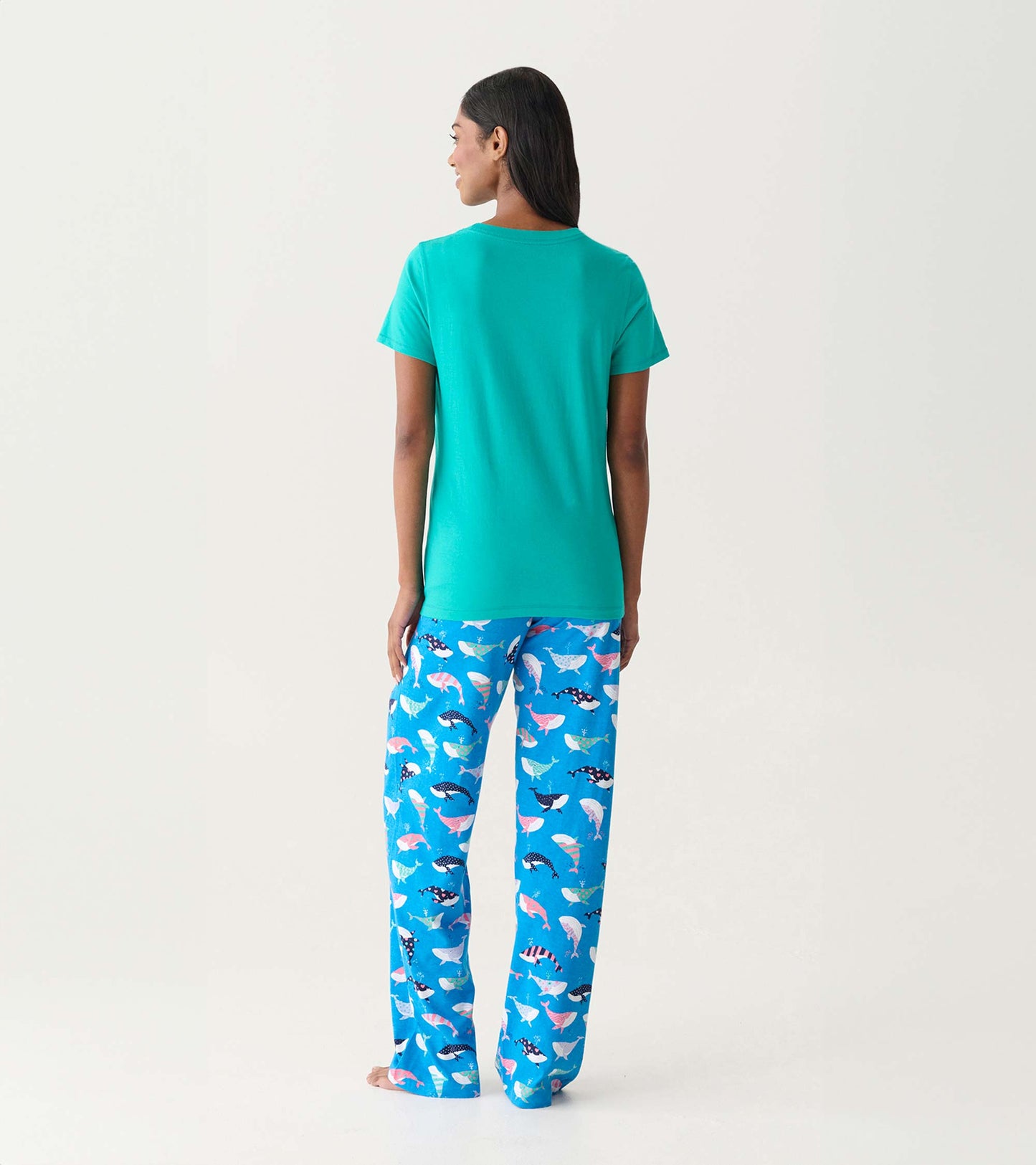 Back view of a teal short-sleeve pajama T-shirt with blue whale-print pajama pants