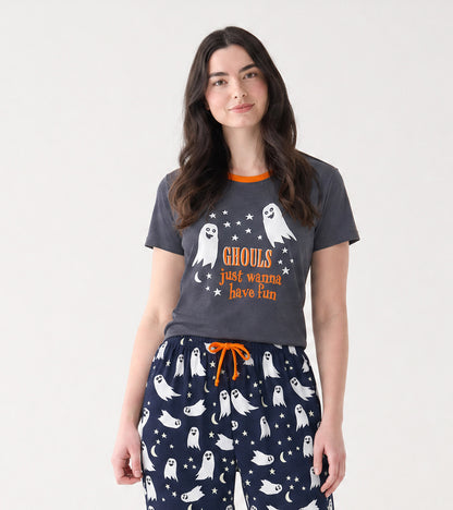 Model wearing dark gray pajama T-shirt with orange collar and ghost graphic, paired with navy ghost print pants