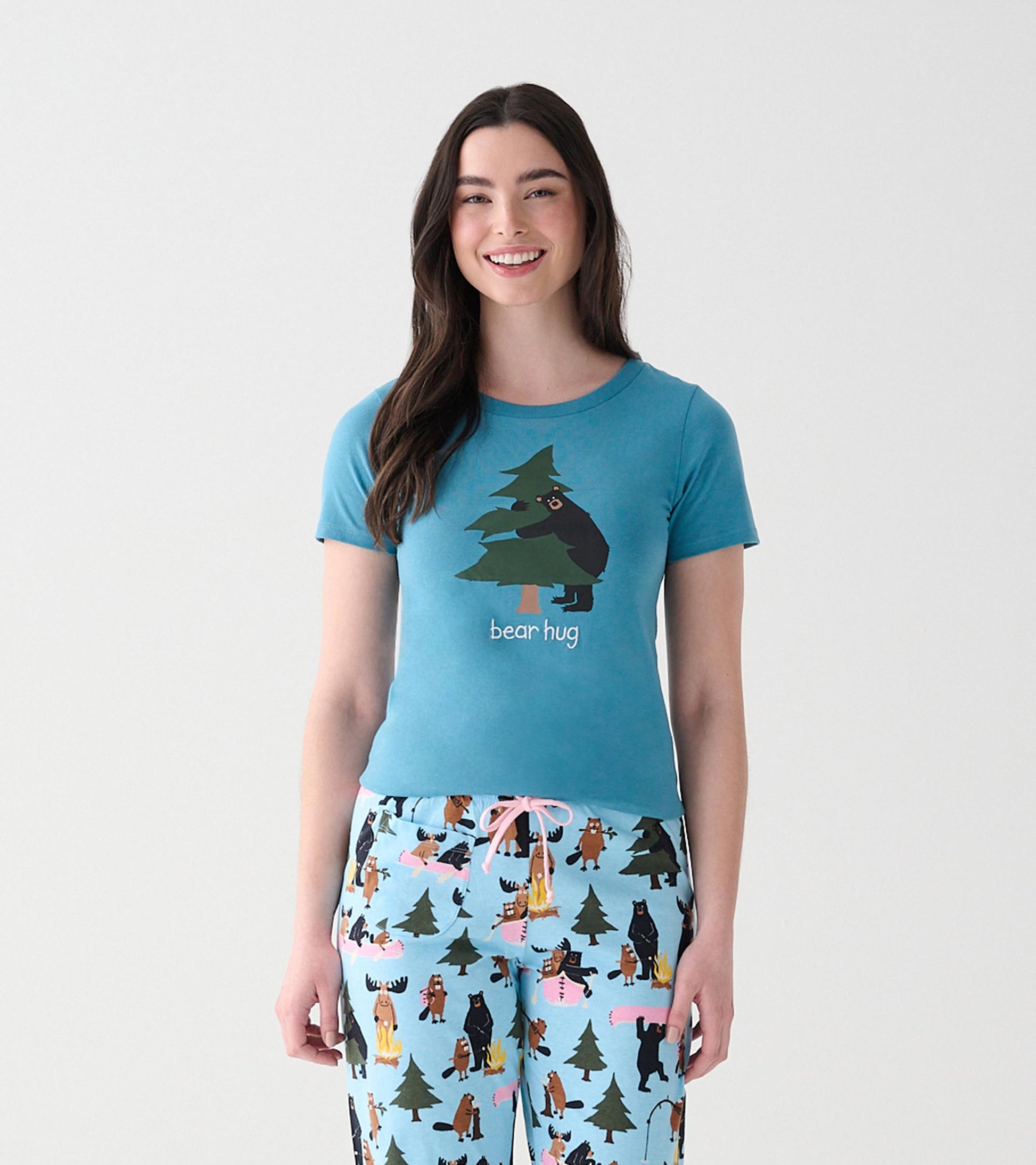 Front view of blue women's pajama T-shirt with bear hugging a tree graphic and 'bear hug' text