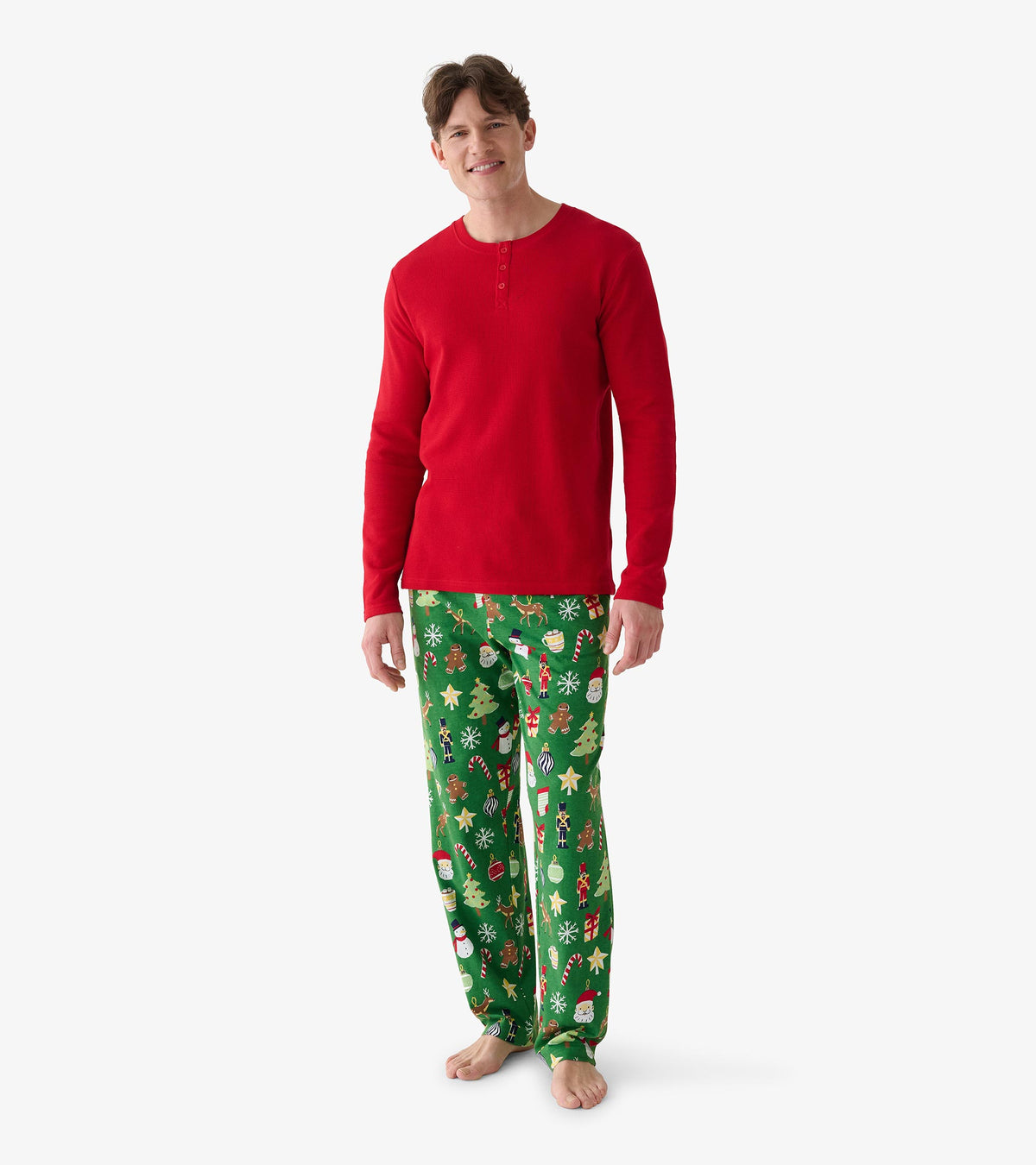 Men's red waffle henley, full front view, paired with green pants printed with festive holiday icons