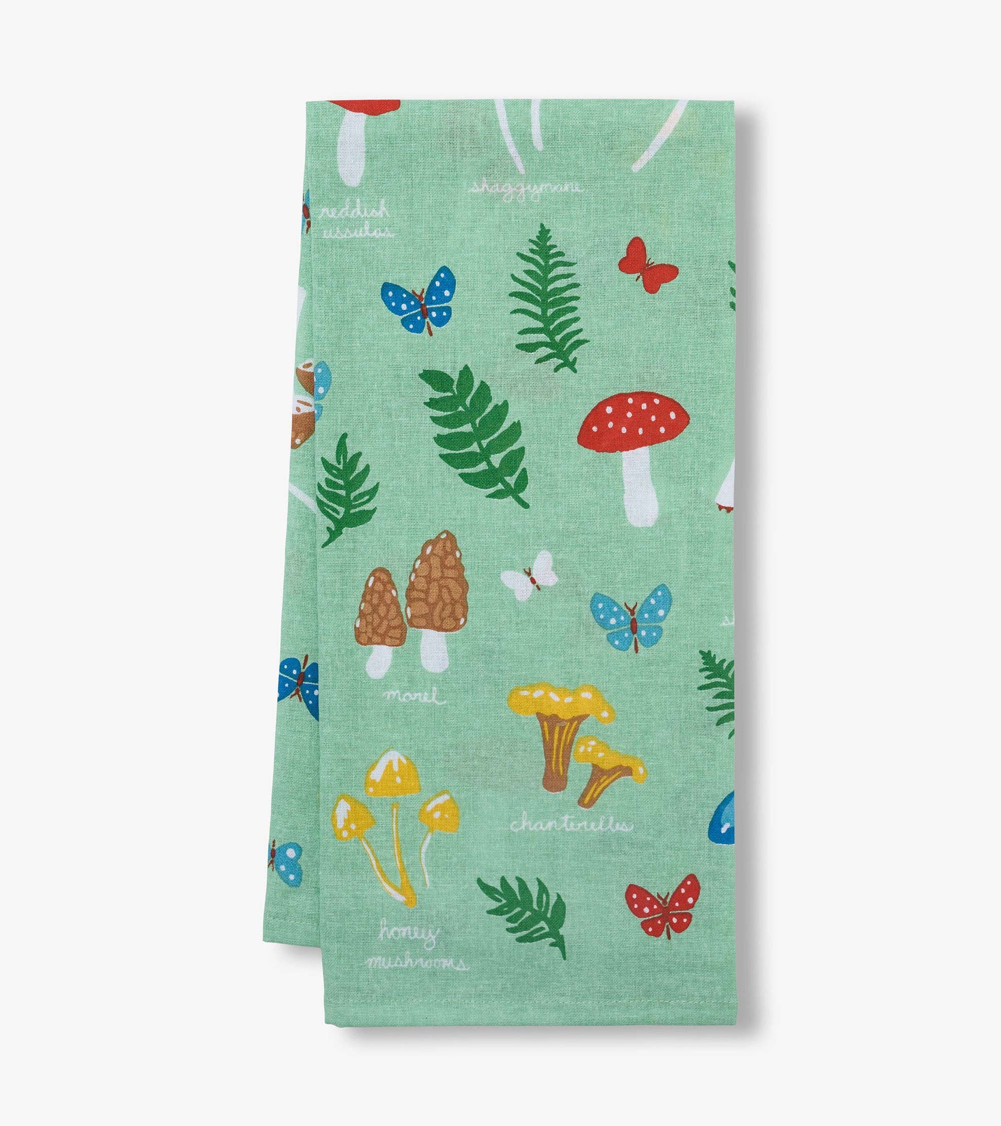 Green tea towel with mushroom, butterfly, and fern print, folded and hanging vertically
