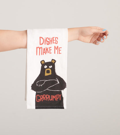 White tea towel featuring a grumpy bear illustration and the text "Dishes Make Me Grrrumpy." Ideal for kitchen use.