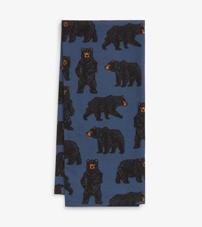 Blue tea towel featuring a bear pattern in black and orange, ideal for kitchen use.