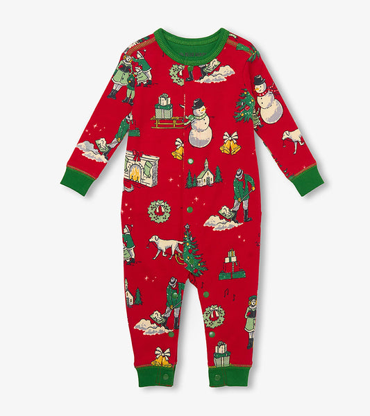 Front view of baby red Christmas union suit with green trim and vintage holiday scene print