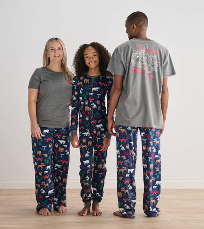 Child wearing navy True North printed onesie with adults in matching pajama bottoms and gray tops