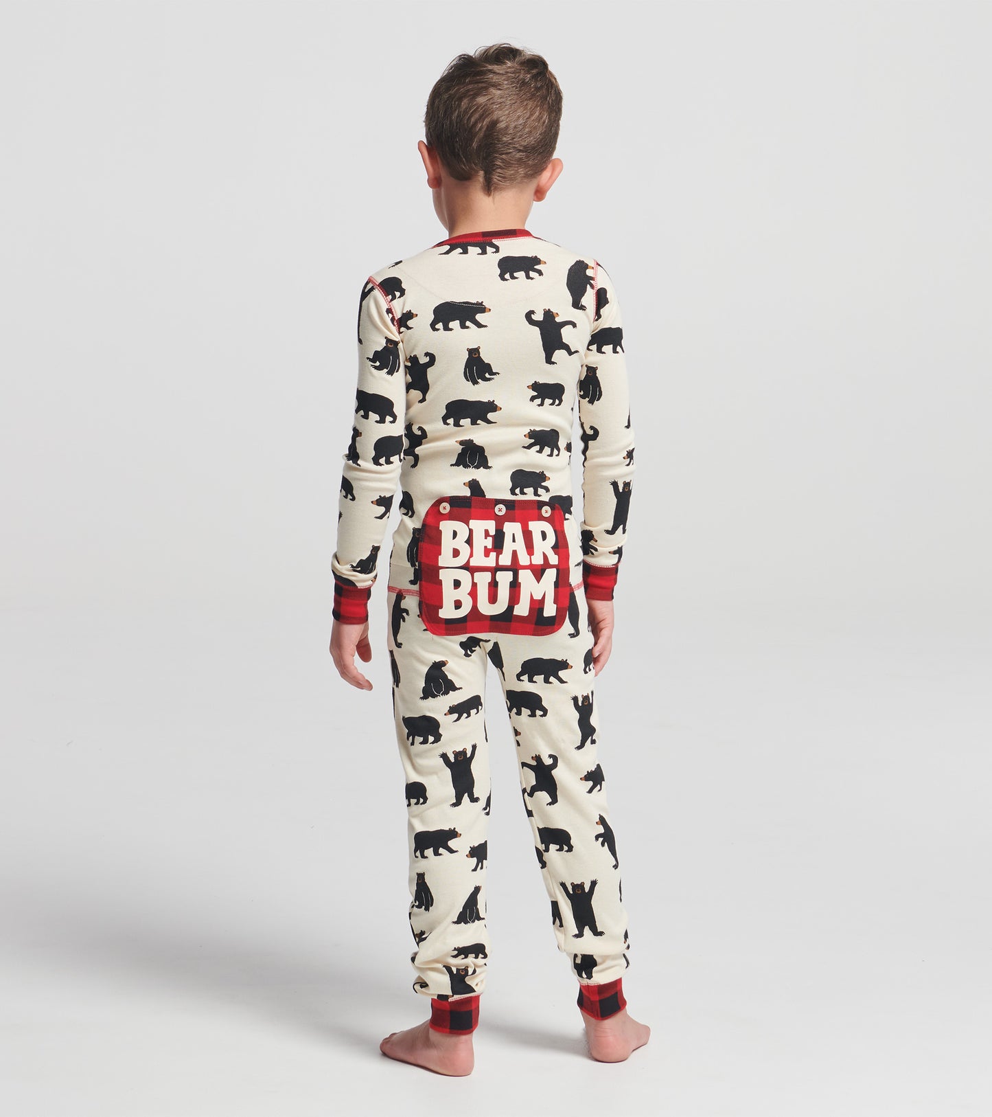 Kids' black bear patterned onesie with red accents and "BEAR BUM" graphic on the back, shown from the back.