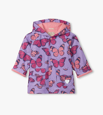 Purple hooded rain jacket with pink butterfly print, button front, and front pockets, front view.