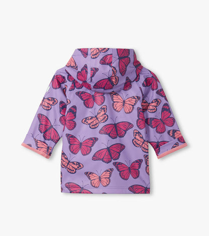 Purple hooded rain jacket with pink butterfly print and three-quarter sleeves, back view