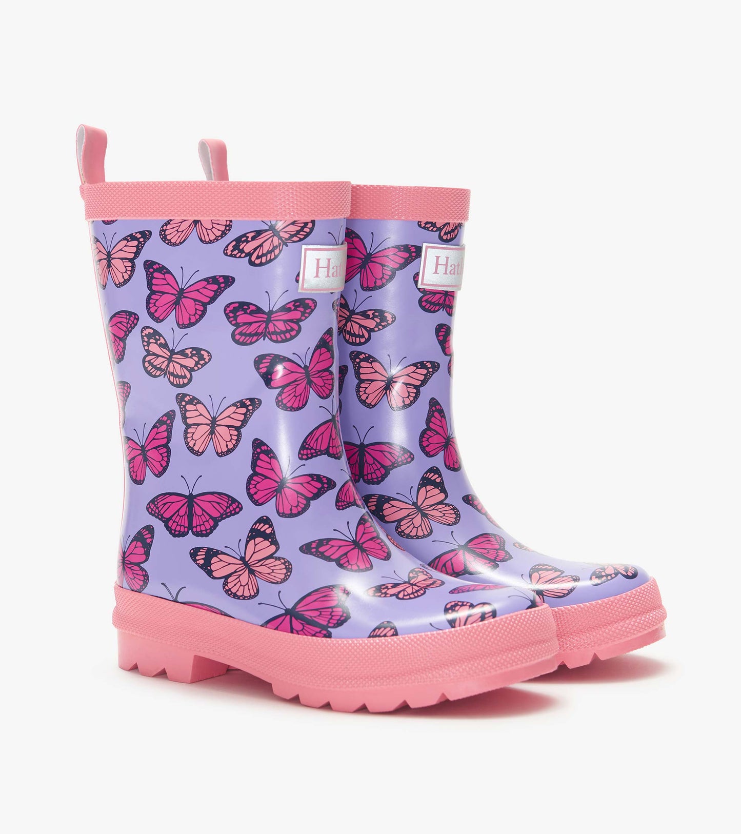 Purple kids rain boots with pink butterfly print and pink soles, shown in side view