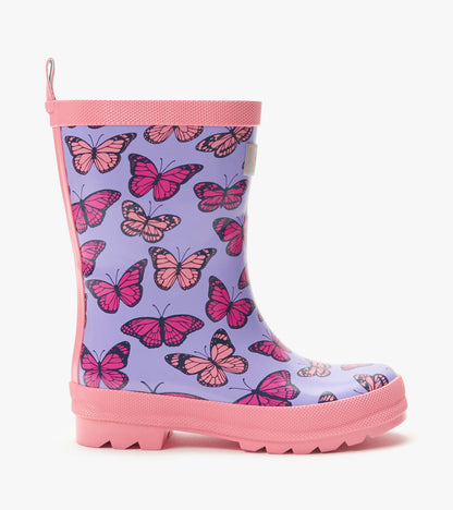 Purple rain boot with pink butterfly print and pink sole, side view