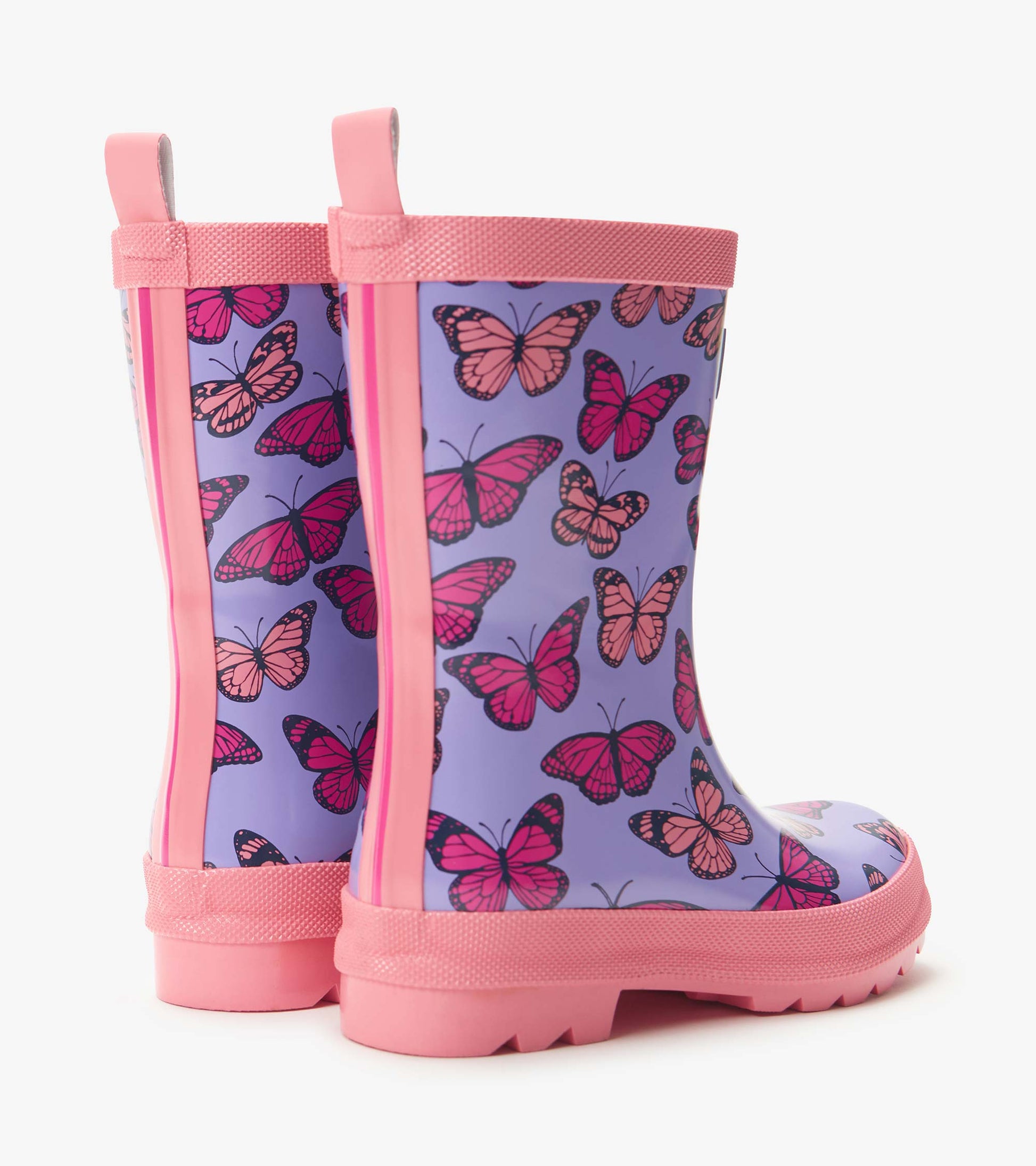 Purple kids rain boots with pink butterfly print and pink trim, shown in side view