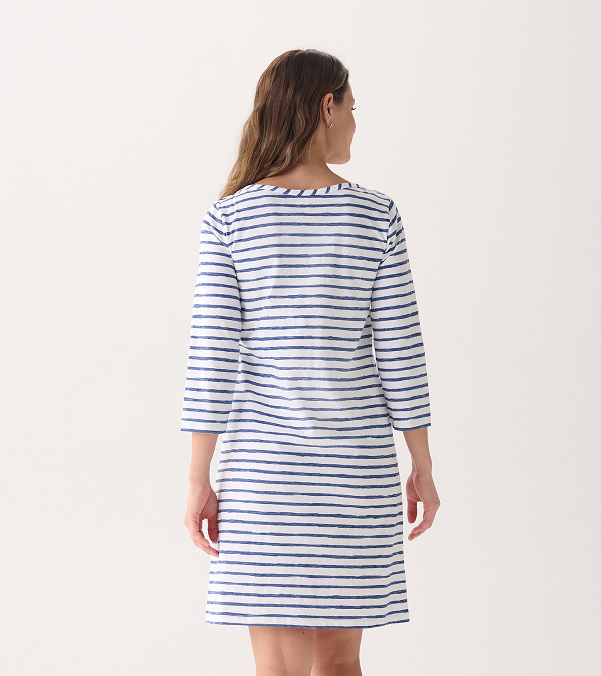 Back view of a women's summer dress featuring watercolor stripes in blue and white, with 3/4 sleeves and a relaxed fit.