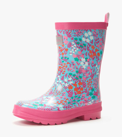 Pink and blue floral kids rain boot with glossy finish and pink sole, side view