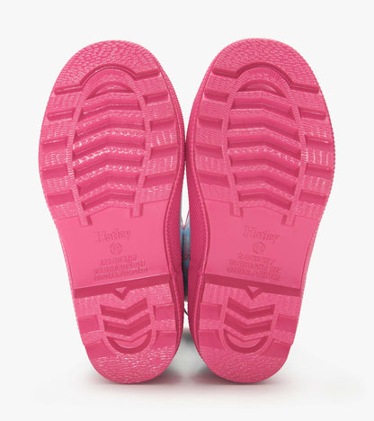Pink rubber rain boots soles with textured tread, shown from the bottom view