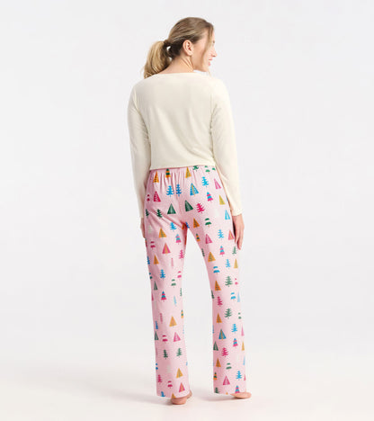 Colorful pajama pants featuring a holiday tree pattern on a pink background, made from soft polyknit fabric.