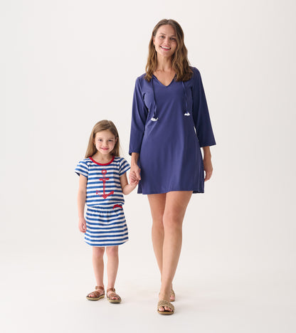 Patriot blue beach dress with a V-neck and long sleeves, paired with a striped dress featuring an anchor design.