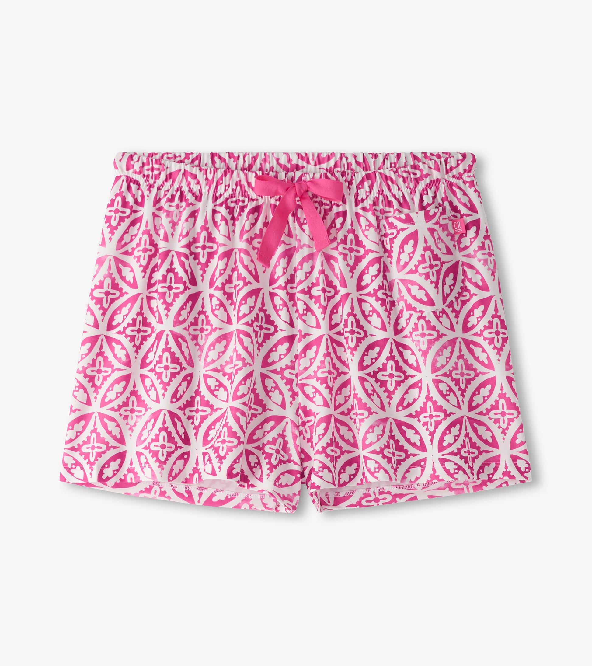Pink pajama shorts featuring a floral pattern and an elastic waistband with a bow tie detail.