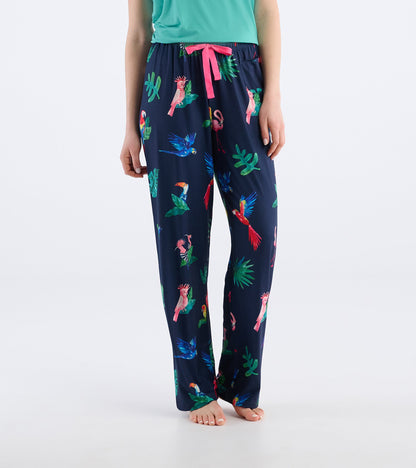 Navy pajama pants featuring a tropical bird print, with a pink drawstring and relaxed fit, ideal for lounging.