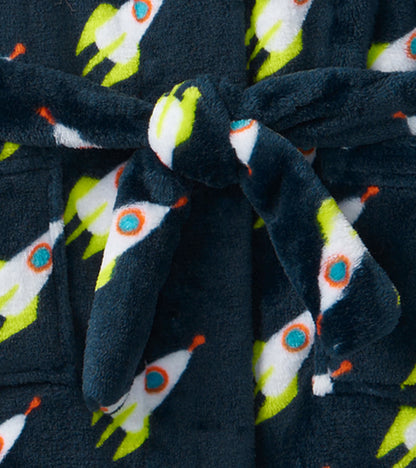 Navy fleece robe featuring colorful rocket patterns, tied at the waist with a matching belt.