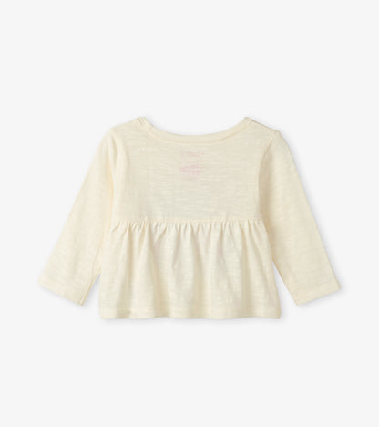 Cream long sleeve baby tee with a gathered waist and soft, lightweight fabric. Back view shows a simple design.