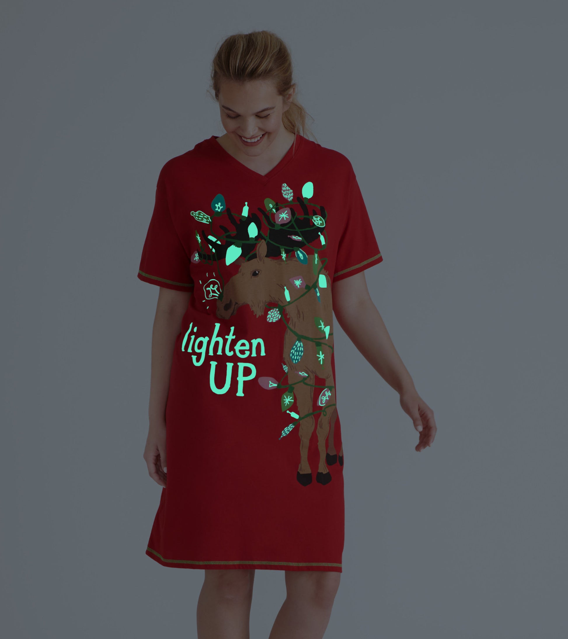 Red glow-in-the-dark sleepshirt featuring a moose design with holiday lights and the phrase "lighten UP.
