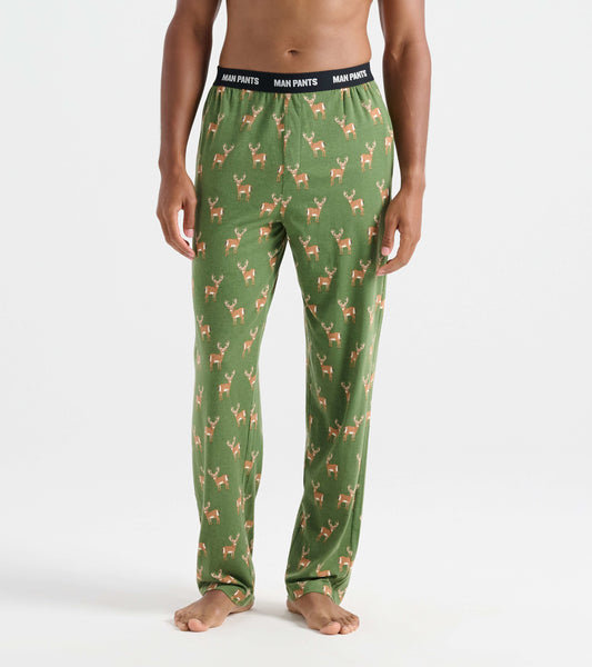 Green pajama pants featuring a deer pattern, with an elastic waistband labeled "MAN PANTS.