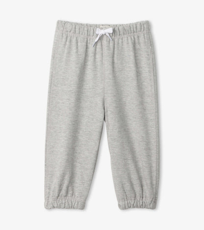 Light grey French terry baby joggers with an elastic waistband and cuffed ankles. Suitable for casual wear.