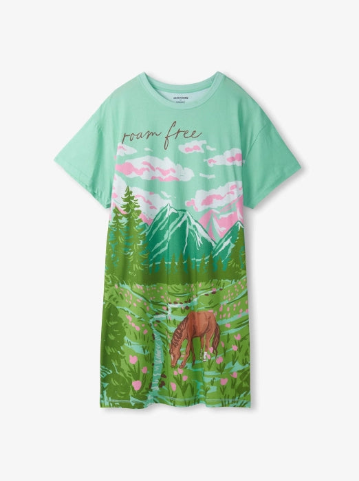 Promotes the women's sale collection. Showing mint green graphic t-shirt dress with mountain and meadow print.